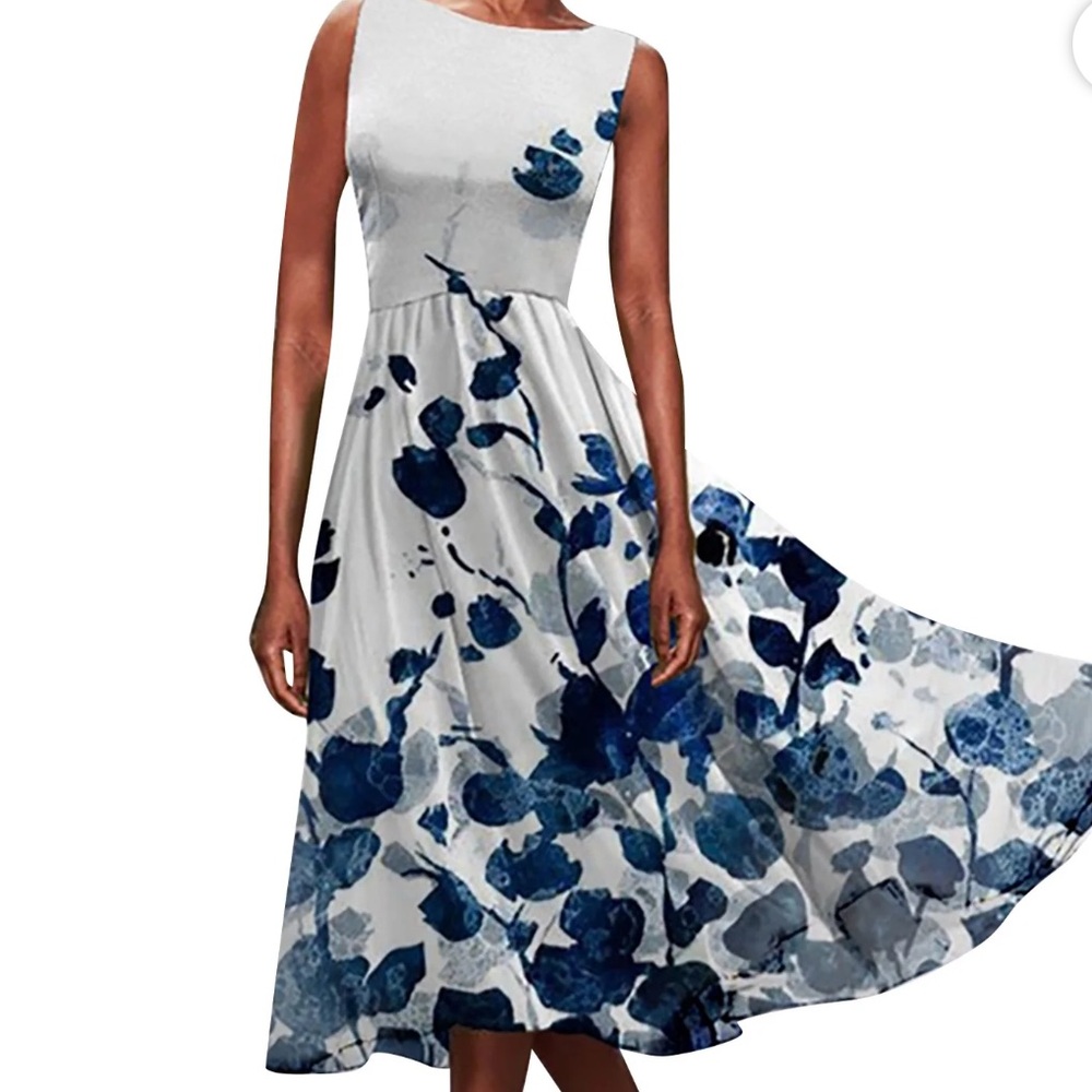 Beautiful medium sleeveless white dress with beautiful blue flowers.